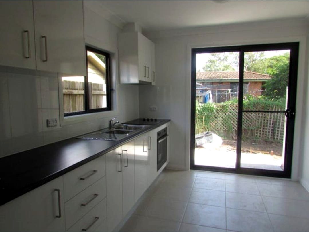 Kitchen in the Doonside home, with sliding doors to the backyard
